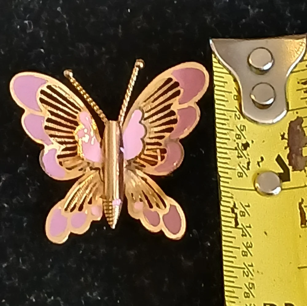 Vintage goldtone filigree butterfly brooch with pink accents